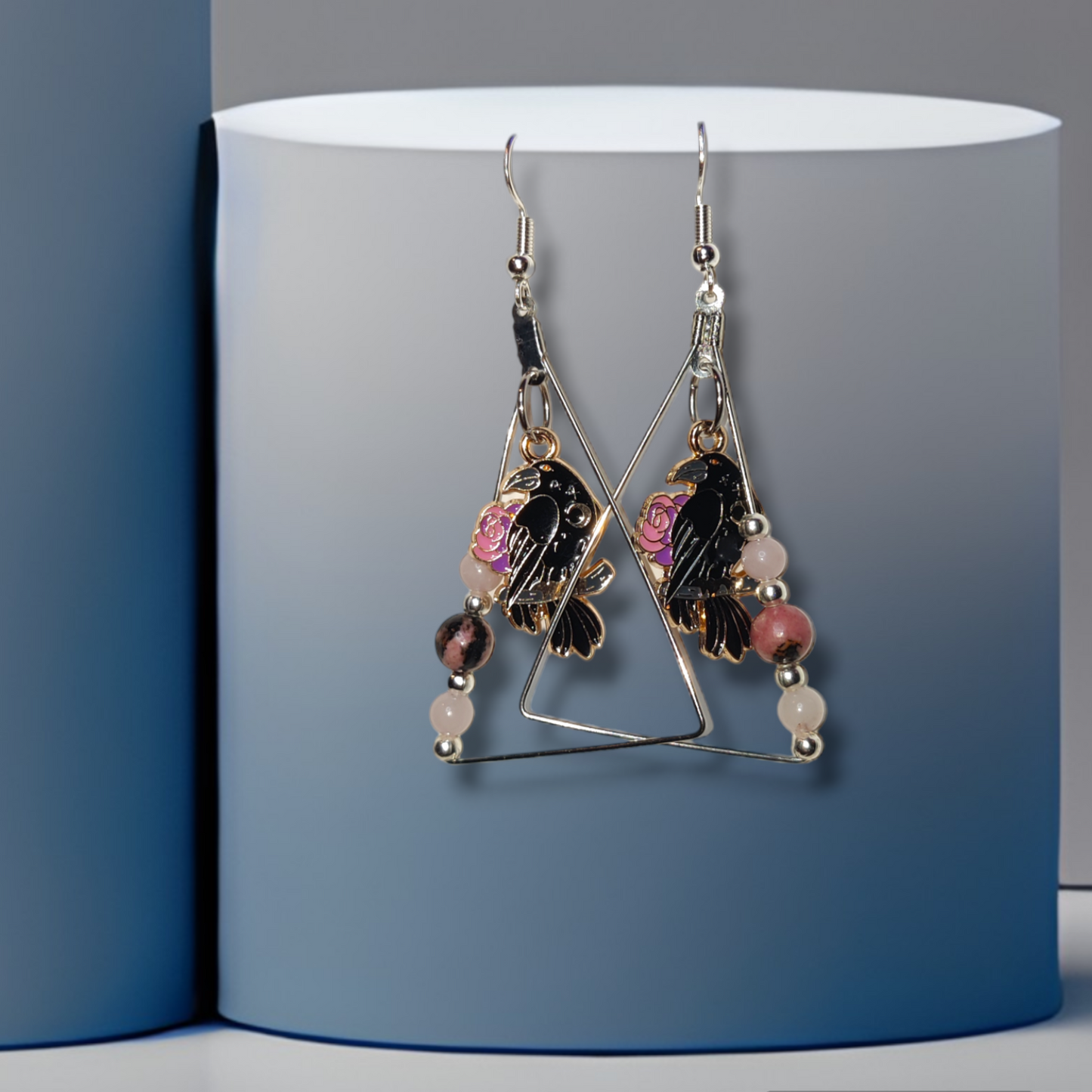 crow handmade crystal earrings with rose quartz and rhodonite for halloween.